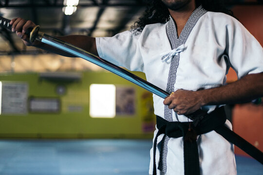 Martial arts fighter unsheathing the katana