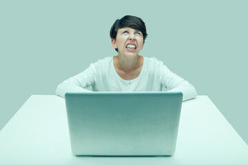unhappy and desperate woman with laptop