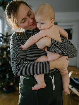 Mom holding a naked baby