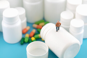 Miniature creative old man and medicine