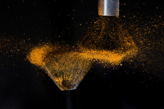 Make up brushes with golden face powder