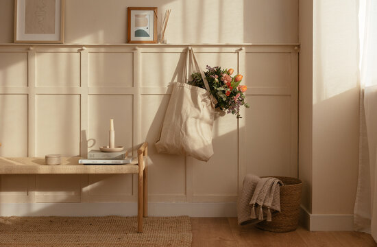 Bag with bunch of flowers in room