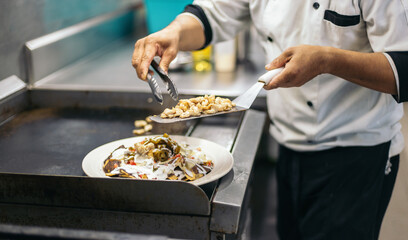 Nachos preparation in professional kitchen