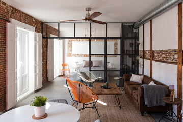 Living room with large windows in modern apartment