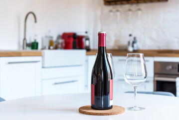 Close up of red wine bottle and glasses