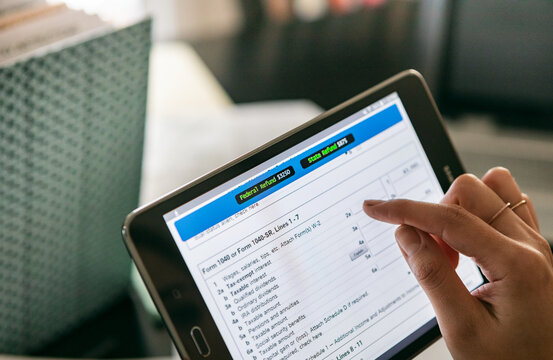 Taxes: Woman Using Online Tax Form