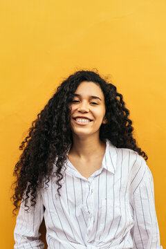 Portrait of young woman with curly hair