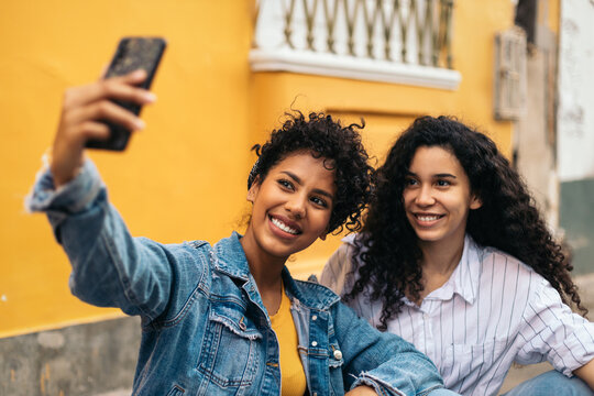 Friends taking a selfie in the city