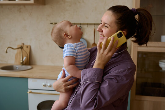 a woman with a child on the phone talking