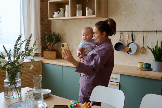 a woman with a child on the phone talking