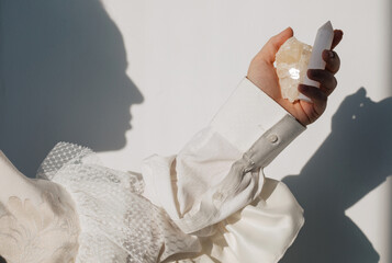 Anonymous woman holding crystals
