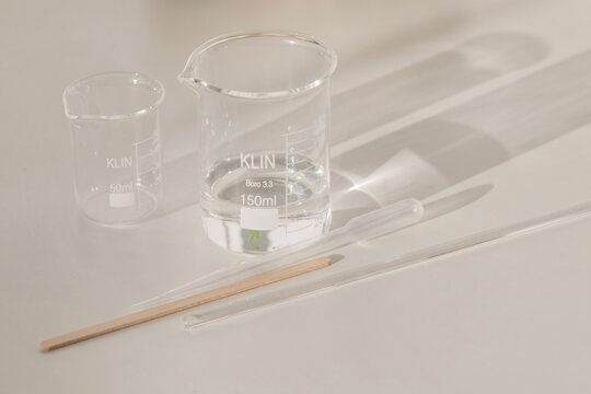 Beakers and laboratory tools on table
