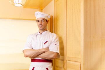 Male chef posing in his workplace.