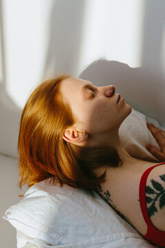 Dreamy woman portrait on bed
