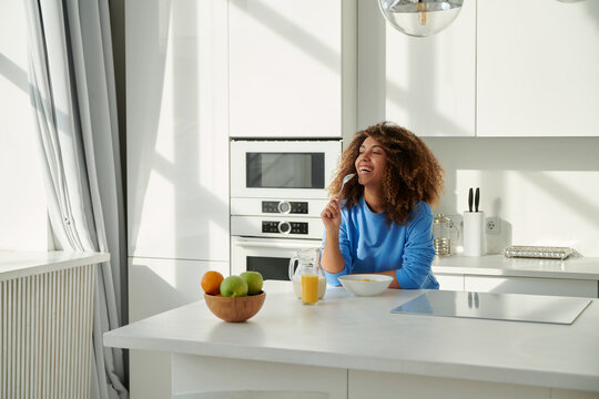 Woman preparing breakfast in kitchen