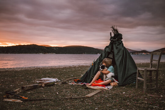 boy and dog camping