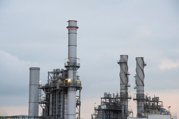 Oil refinery industry at sunset - factory - petrochemical plant