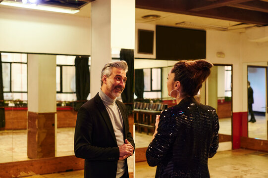 Flamenco dancers talking in a studio