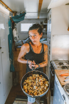 strong funny woman showing dinner