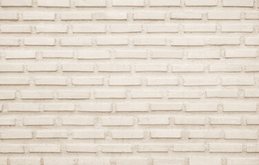 Cream and white brick wall texture background. Brickwork backdrop interior design element.