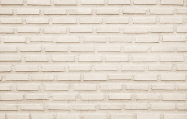 Cream and white brick wall texture background. Brickwork backdrop interior design element.