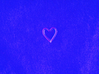Heart on fabric in blue tones closeup