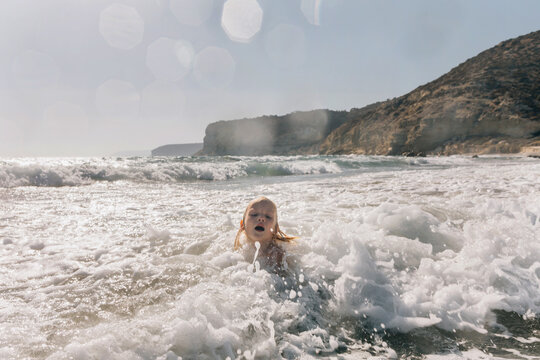 Child in sea foam