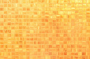Yellow ceramic wall and floor tile abstract background. Design geometric orange mosaic texture decoration of the bedroom. Simple seamless pattern grid for backdrop hospital wall, canteen and kitchen.