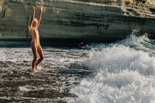 Child and sea wave
