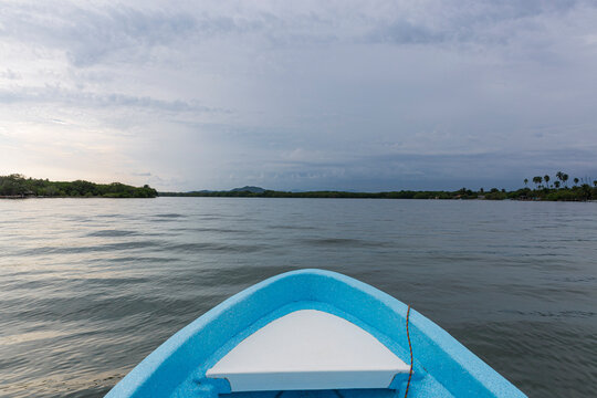 the front of a boat in the middle of a lagoon