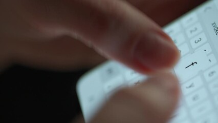 Female hands typing text on smartphone close-up