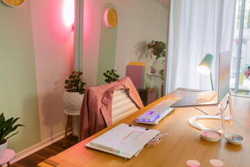 Girly workspace with led lights and suit on office chair