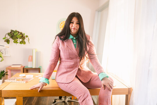 Professional young woman sitting at desk 
