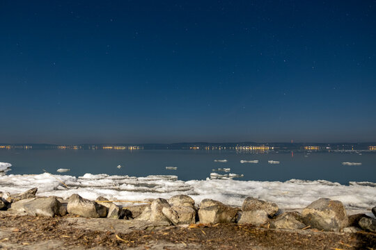 Ice floes float on a frozen lake