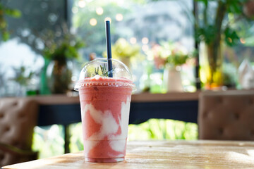 Strawberry Yogurt Smoothie with green soft background.    