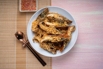 Fried Flathead lobster or Mantis shrimp fried with Garlic and Pepper Served with chili, lime, spicy sauce  , Seafood dish.