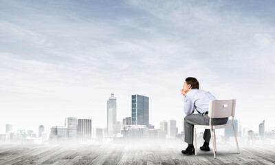 Young businessman sitting on an office chair