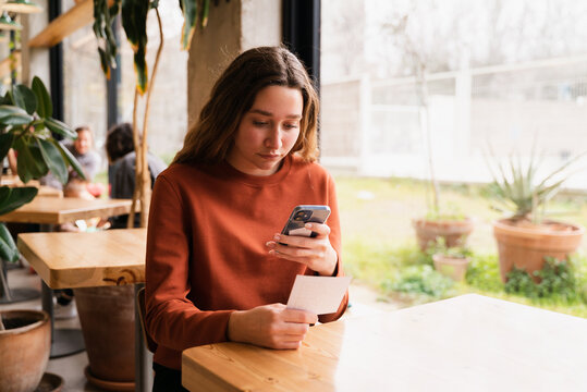 Customers Scanning Menu QR Code On Cell Phone