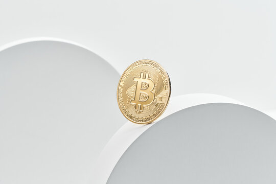 Bitcoin balancing on round plate