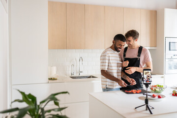 Gay Couple Recording Themselves Cooking 