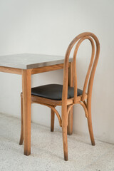 Classic set of wooden chairs and table with wooden blank space photo frame interior on the white marble floor for modern house and decoration living room.