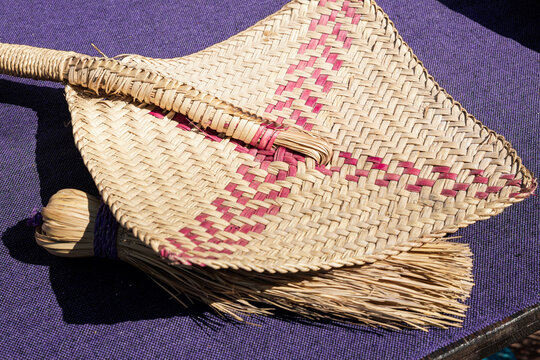 Kitchen tool palm fan on a purple cloth in Oaxaca