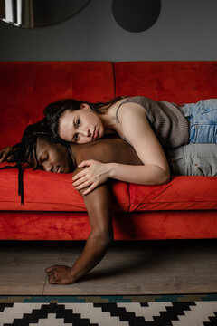 the girl lies thoughtfully on her boyfriend