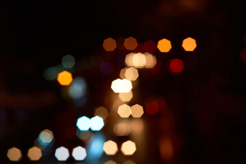 Fototapeta premium Dreamy light spots in the city at night