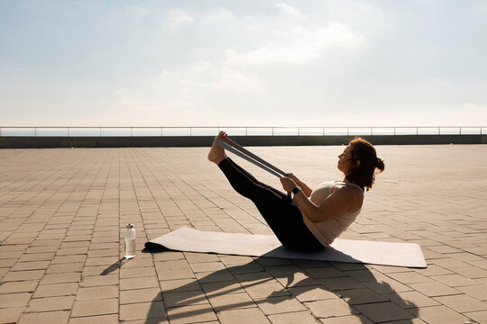 curvy  woman practicing yoga