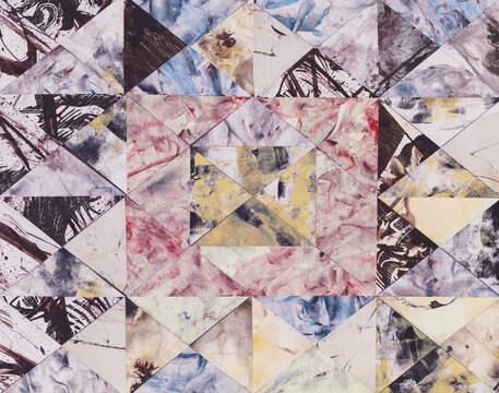 A collage assembled from trianglar painted elements.