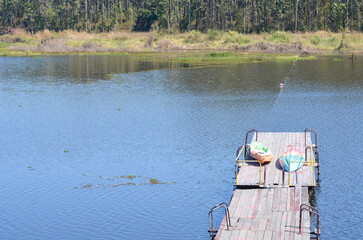 Fototapeta premium Blue lake and kayak at Maepuem national park at Phayao province of Thailand