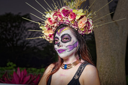 Young woman with sugar skull makeup. Catrina portrait.