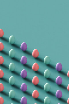 Colorful Easter eggs on a pastel blue background with copy space. 3d 