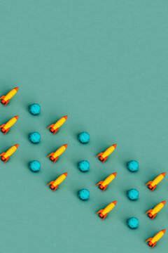 rows of Space shuttles and space rock on green background